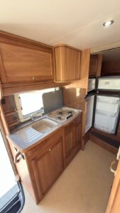 The 2026 Edition of the National Electric Code (NEC) is now published, which finalizes the grounding monitor interrupters requirement. All RVs with 30A or 50A electrical service will be required to install a Grounding Monitor Interrupter (GMI), which is a loss-of-ground device. Before electrical current can pass into the RV, a GMI will check the receptacle for a proper ground connection. During use, the GMI will also monitor the ground connection to the RV and, if lost, will disconnect the power to the RV. Background on the National Electric Code, RVs, RV Parks and Campgrounds, and Grounding Monitor Interrupters The National Electric Code governs electrical installations in the United States. It is updated and published by the National Fire Protection Association (NFPA) every three years. Article 551 of the National Electric Code contains the electrical requirements for both RVs and RV Parks and Campgrounds. These requirements work hand in hand to ensure safety for the users of both.  Over the last 6 years, there have been several public inputs to Article 551 addressing “hot skin” conditions.  On the RV Parks and Campgrounds side, it was suggested that Ground Fault Circuit Interrupter (GFCI) receptacles for the 30A and 50A services be installed on the RV pedestal. That suggestion was not adopted because electrical leakage current from the various electrical devices in an RV would cause a nuisance trip of the GFCI. Another suggested remedy was to install a reverse polarity device on the RV. While improving safety, a reverse polarity device fails to protect against a “hot skin” condition. In the 2023 edition of the National Electric Code, the requirement for the reverse polarity device was replaced with a requirement for a loss-of-ground device. However, because no loss of ground device existed in 2023, enforcement of the requirement was delayed to January 1, 2026. The loss of ground device requirement was further defined as a GMI, resulting in what will be published in the 2026 Edition of the National Electric Code as outlined above. What is a “Hot Skin” Condition? “Hot skin” is a term used to describe when an RV’s metal exterior, metal frame, or other metal items become electrified, which is a serious electrical safety hazard caused by improper grounding or electrical faults. The National Electric Code and the RV industry continue to improve the electrical safety of RVs for consumers through new requirements like the GMI. What is a Grounding Monitor Interrupter? A GMI tests the receptacle it is plugged into to ensure it is wired correctly and has a proper ground connection. If incorrect wiring or a loss of ground connection is detected, the GMI will not allow electricity to pass through or will disconnect power if the loss of ground occurs during operation. 